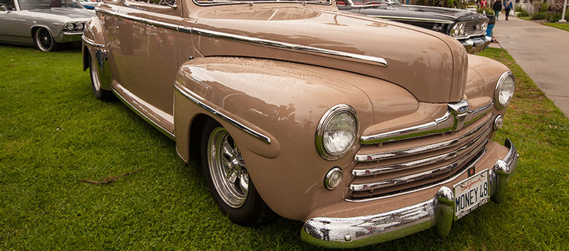A shiny, coffee-ice-cream colored classic car