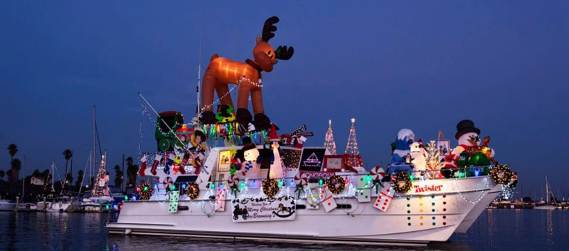 A Parade of Lights participant decked out with Christmas lights; features a reindeer, classic games like Twister and more