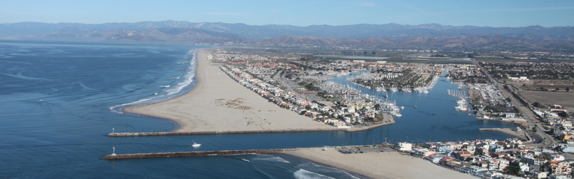 Aerial view of the Channel Islands Harbor channel and breakwater