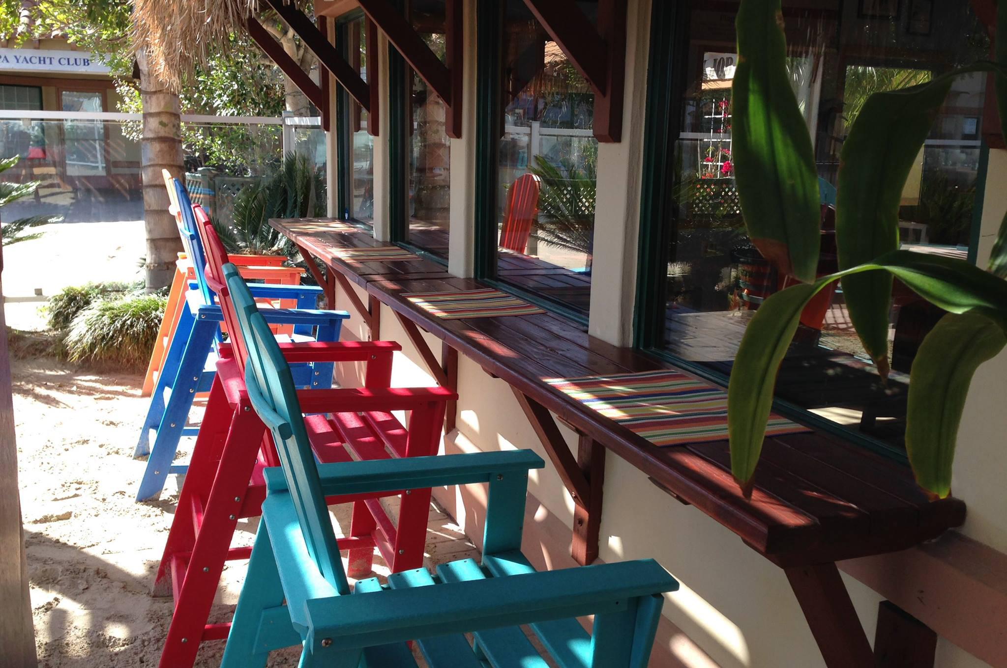 Colorfully painted chairs line Mrs. Olson's Coffee Hut bar