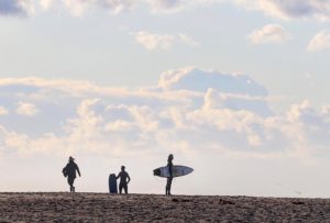 Surfers silhouetted at Silver Strand beach