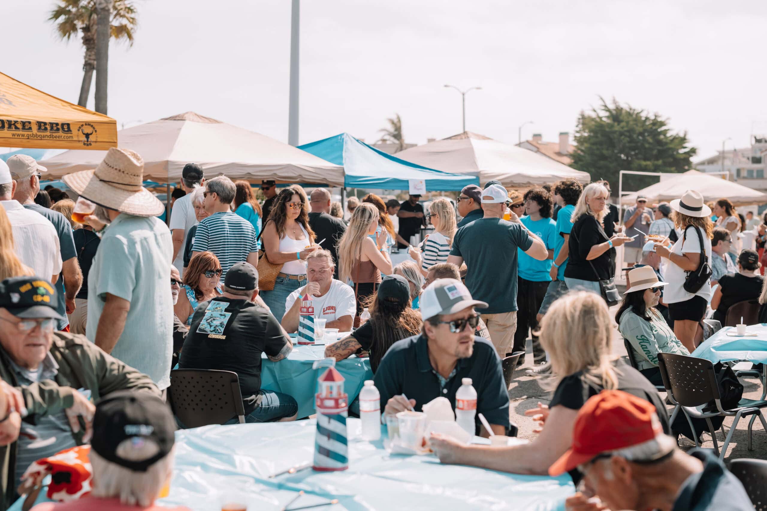 Outdoor event at Channel Islands Harbor with attendees enjoying chowder and festivities.