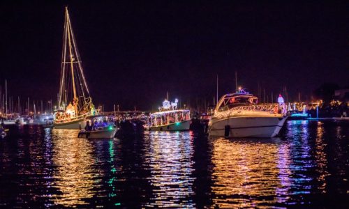 Brightly light and playfully themed boats on Parade in the harbor